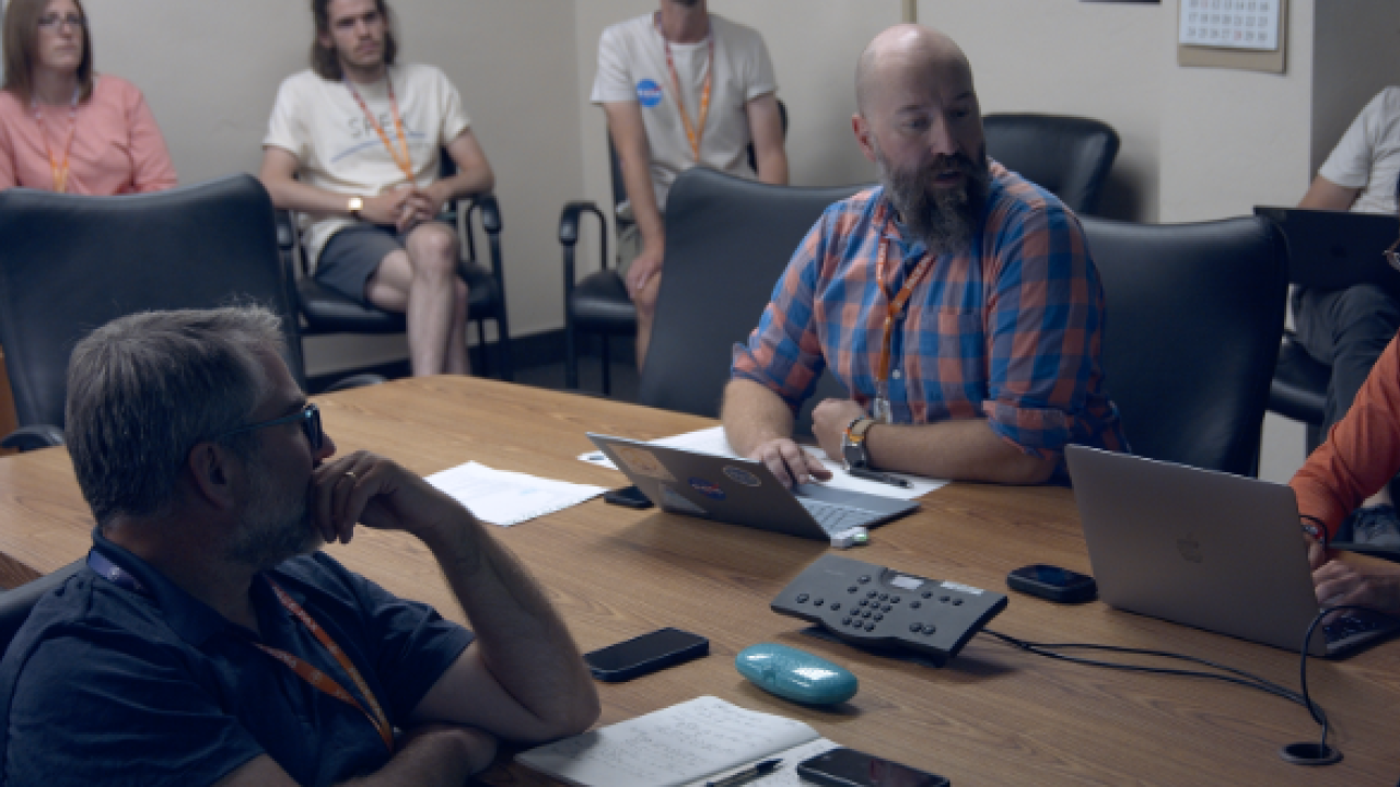 Knobelspiesse (bottom left), LeBlanc (center), and other members of the PACE-PAX team gather around the conference table during one of the pre-flight briefings for the campaign. Credit: NASA