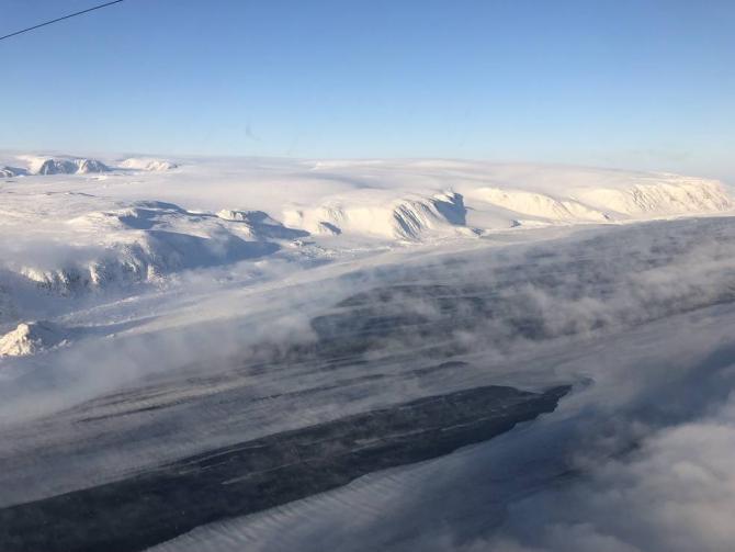 Frazil ice (slushy sea ice), leads (openings in the ice pack) and sea smoke in a fjord in Devon Island, Canada, spotted during an Operation IceBridge survey flight on Apr. 3, 2019. Credits: NASA / Eugenia De Marco