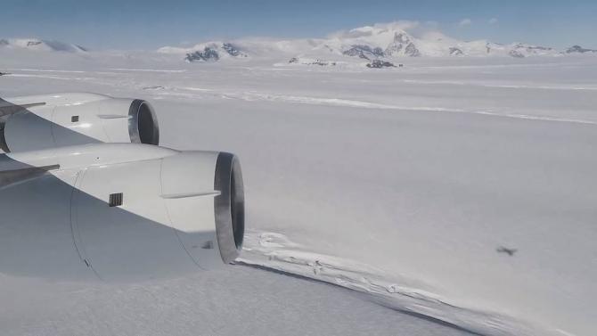 A view from Operation IceBridge's aircraft of Crosson Ice Shelf, foreground. Mt. Murphy is in the background. Credits: NASA/OIB/Michael Studinger