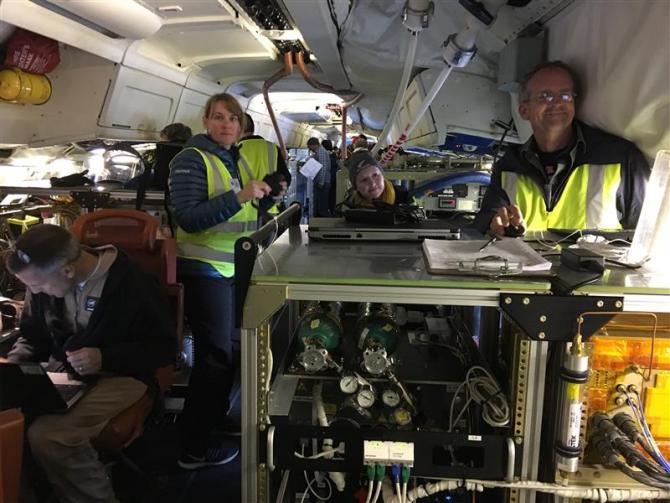 The inside of NASA' DC-8 is crammed with instrumentation and crew for the ATom mission. - Credit:Joe Katich, CIRES/NOAA