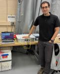 Daniel Shy with the in-Situ Thunderstorm Observer for Radiation Mechanisms (iSTORM) system prior to uploading on the ER-2