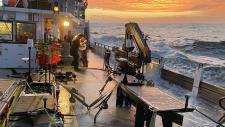 Autonomous wave gliders are seen being prepared for deployment on the deck of the research vessel Oceanus during the pilot campaign for NASA’s Sub-Mesoscale Ocean Dynamics Experiment (S-MODE) in the Pacific Ocean off the U.S. West Coast. Credits: Ben Hodges / Woods Hole Oceanographic Institution (WHOI)