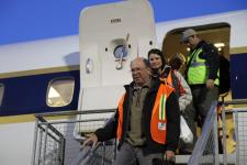 Ambassador Wolff and Ms. Jinnette exiting the DC-8 after another successful IceBridge survey flight. 