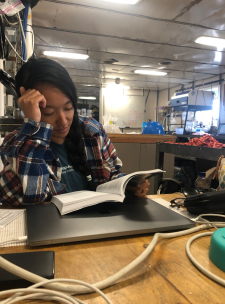 Kelly Luis reading Sweat and Salt Water in the lab