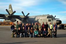 The ARISE research team lines up in front of the NASA C-130 at Eielson Air Force Base, Alaska, for a group photo