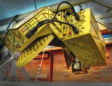 The HIWRAP dual frequency Doppler radar will hang under the Global Hawk. On the left, the golden disc is the antenna and on the right, the two small white discs are the radar beam transmitters, one for each of two frequencies. The whole apparatus spins while flying. 