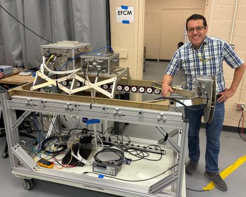 David Corredor and the Electric Field Change Meter (EFCM) mounted in a mezzanine rack ready for the ER-2