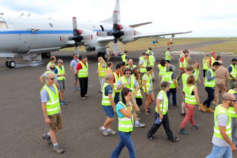 ORACLES team head back into the hangar after group photo. Sao Tome Intnl Airport