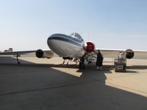 ER-2 mechanic loxing the plane