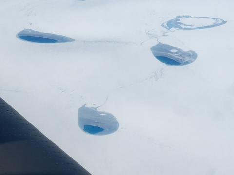 Supraglacial lakes freezing over along Greenland's northwest coast.