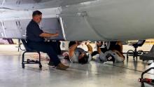 The WB-57 crew (Luis V., Jason H., and Adolfo P.) are working to integrate the SABRE payload before a maintenance flight. 