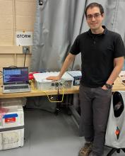 Daniel Shy with the in-Situ Thunderstorm Observer for Radiation Mechanisms (iSTORM) system prior to uploading on the ER-2