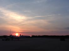 AV-6 contrail after morning takeoff from WFF, T-34 chase in foreground (9.26.12)