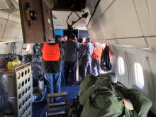 DC-8 crew conducting servicing of the aircraft 